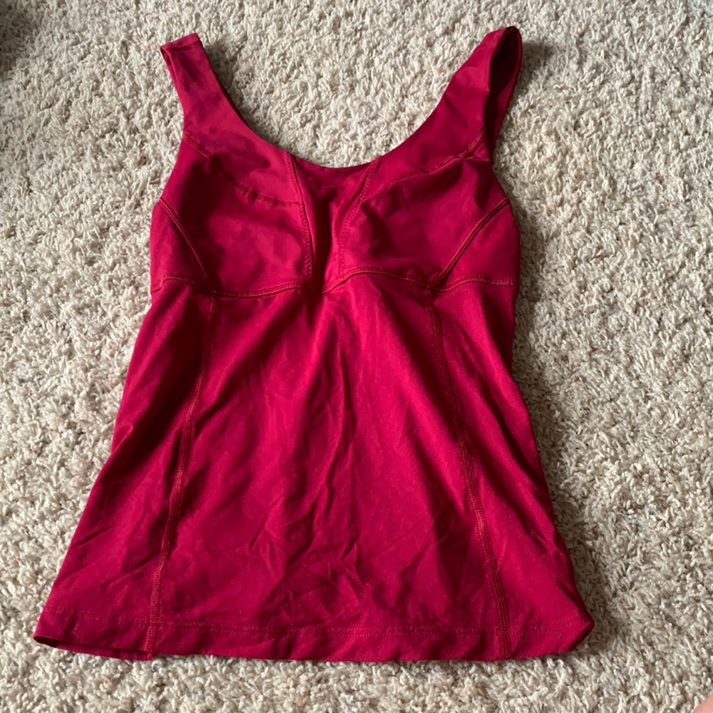 Size 4 Lululemon work out tank top. Burgundy red/ pinkish color.